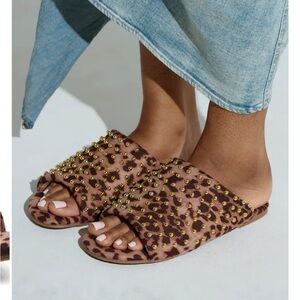 AKIRA BAGGER STUDDED SLIP ON SANDAL IN LEOPARD